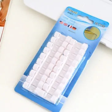 Self-adhesive wire cable organizer clips in black and transparent for desk cable management