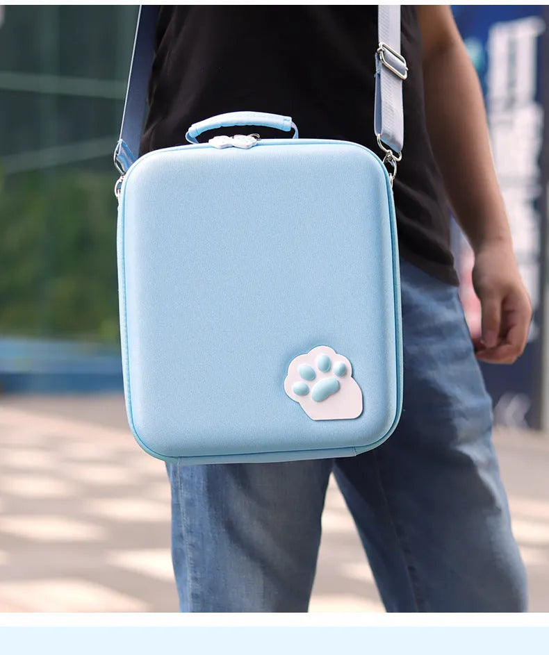 Nintendo Switch accessory storage bag in black, blue, or pink with game cartridge slots and a carrying strap.