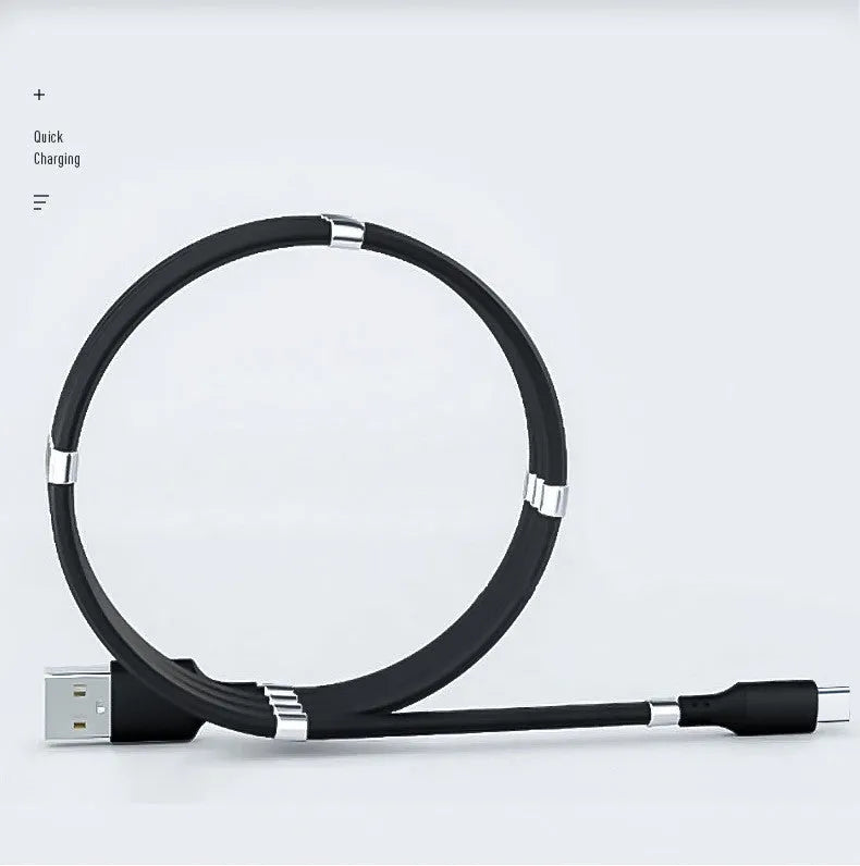 White magnetic nano data line with aluminium alloy joints and multiple connector heads on a desk