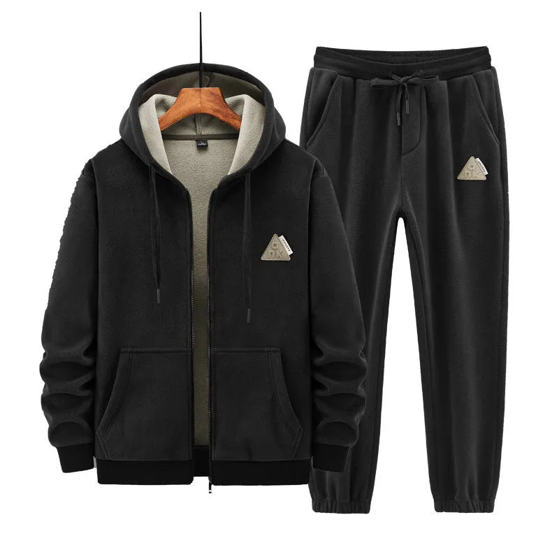 Grey hooded sweater and matching trousers casual sports suit on a hanger.