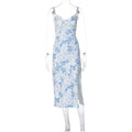Blue lace flowers print long dress with side slit and suspender straps on a model