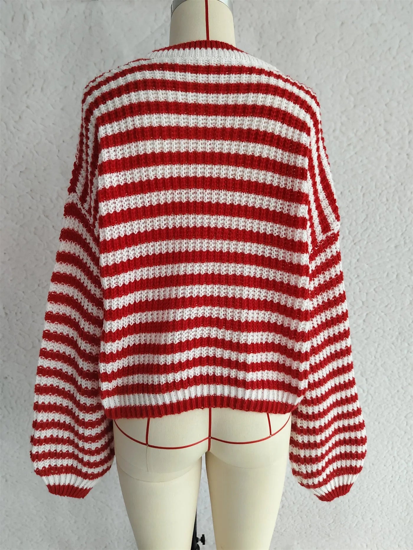 Women's striped loose pullover sweater in polyester knit with round neck and long sleeves