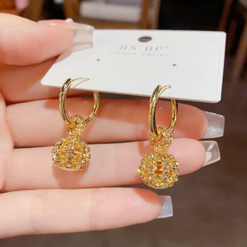 Coffee colour full diamond hollow ball ear clip with thick real gold plating on copper for women, geometric round shape.