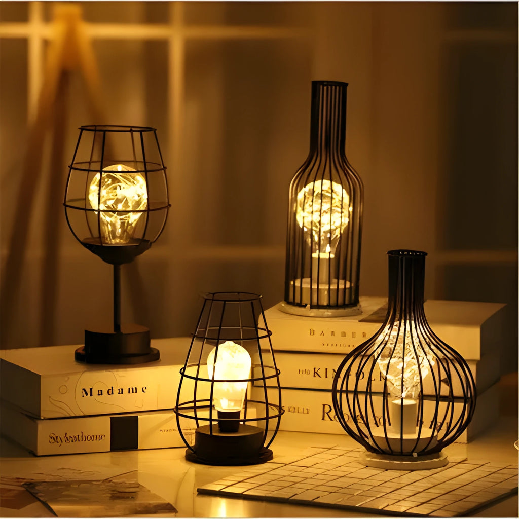 Minimalist hollow iron table lamp in wine glass or bottle design with warm white LED light