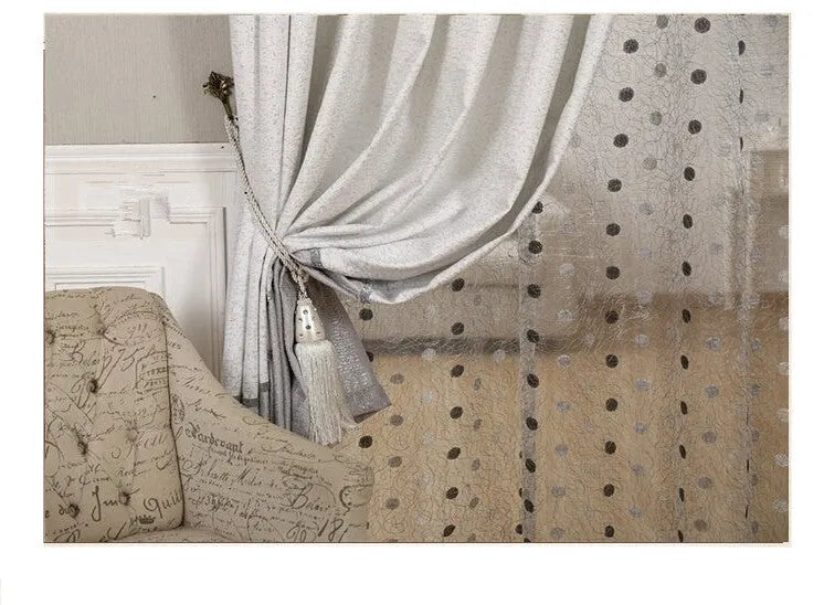 A single blackout curtain panel hung on a track, demonstrating its light-blocking fabric and hook-style header.