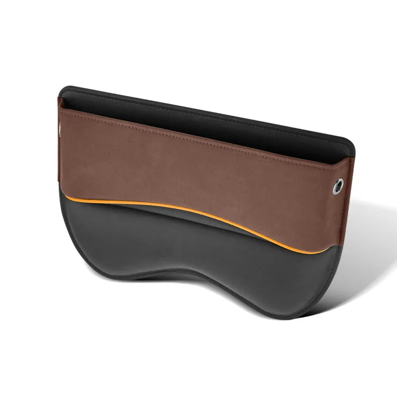 Leather car seat storage box in beige colour on a car passenger seat.