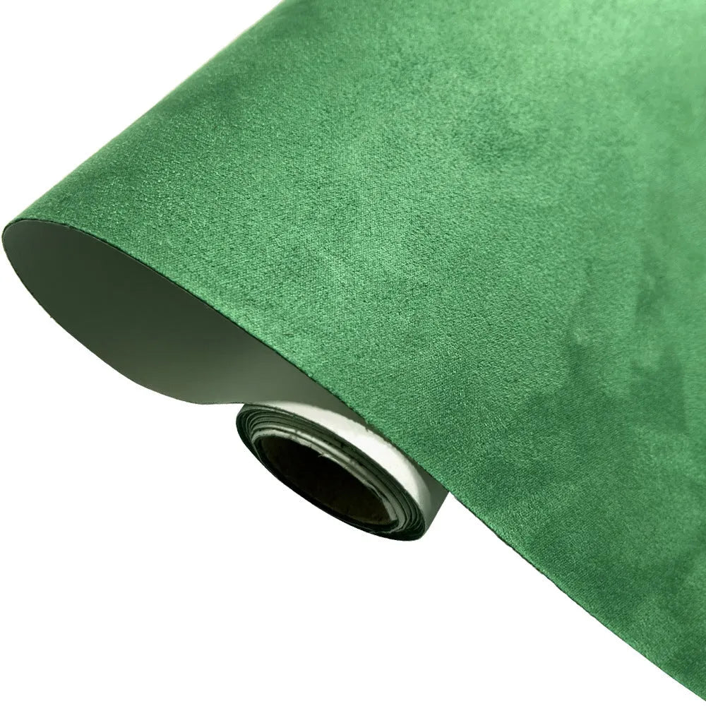 Rolls and sheets of coloured self-adhesive suede leather material for DIY projects.