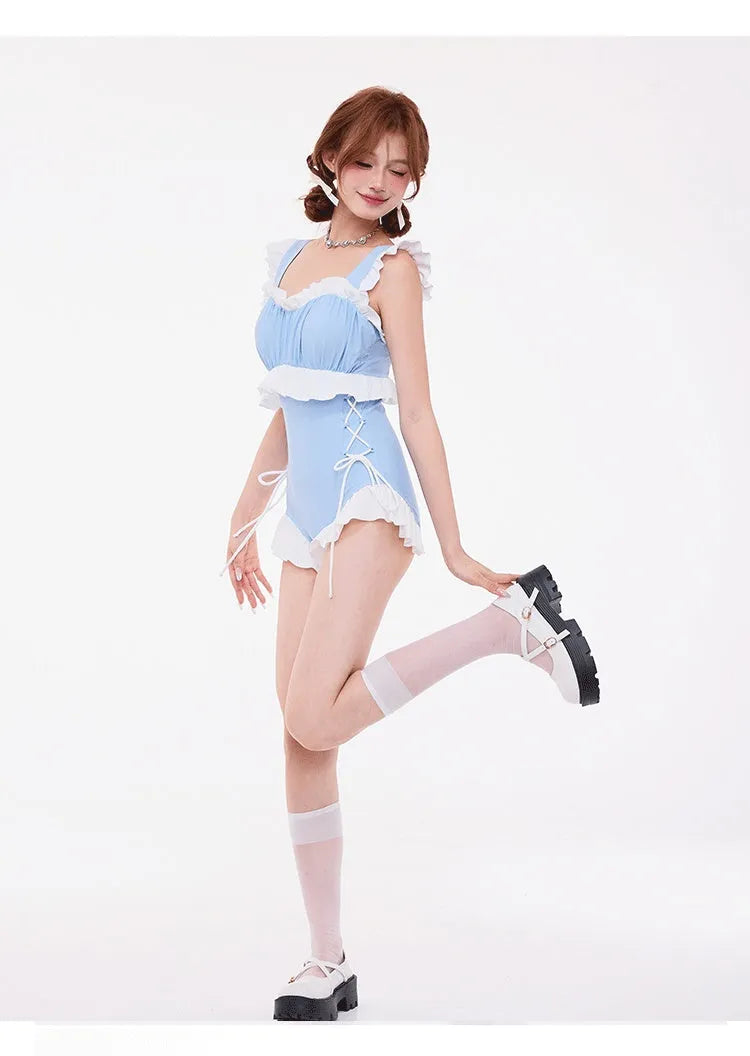 Light blue women's high-waist one-piece swimsuit with lace trim and backless design.