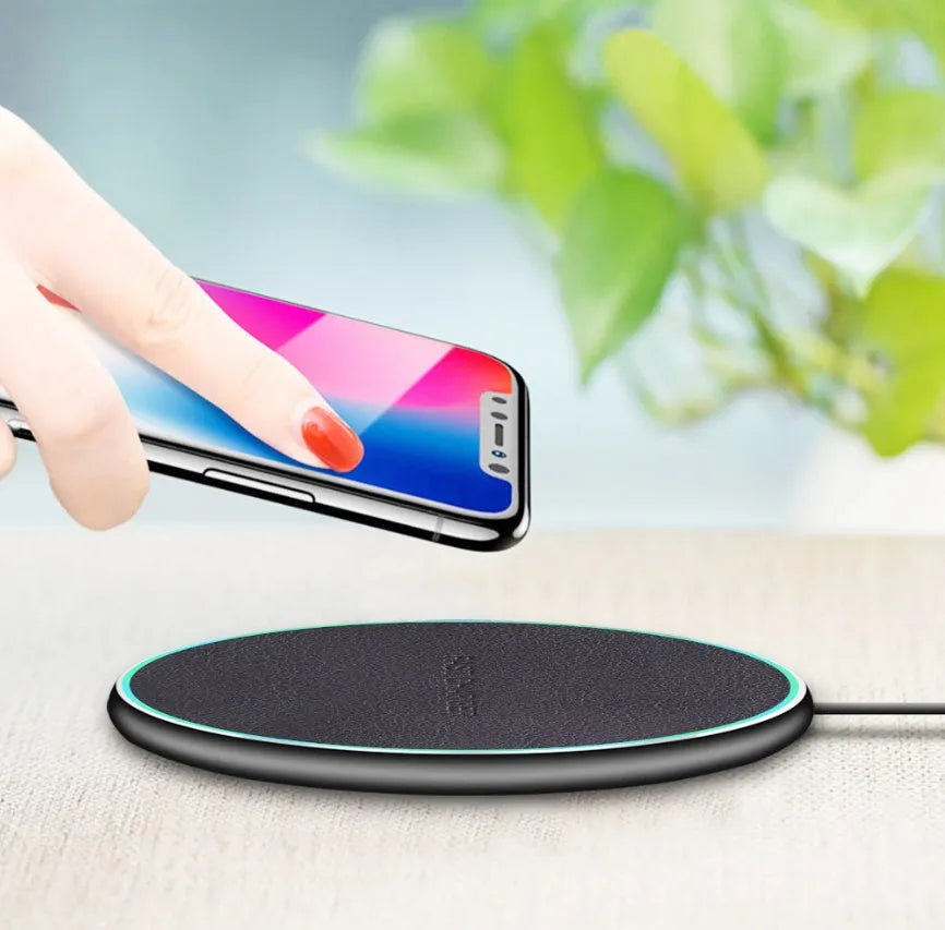 Black Qi wireless charging pad for iPhone 11 with magnetic alignment system