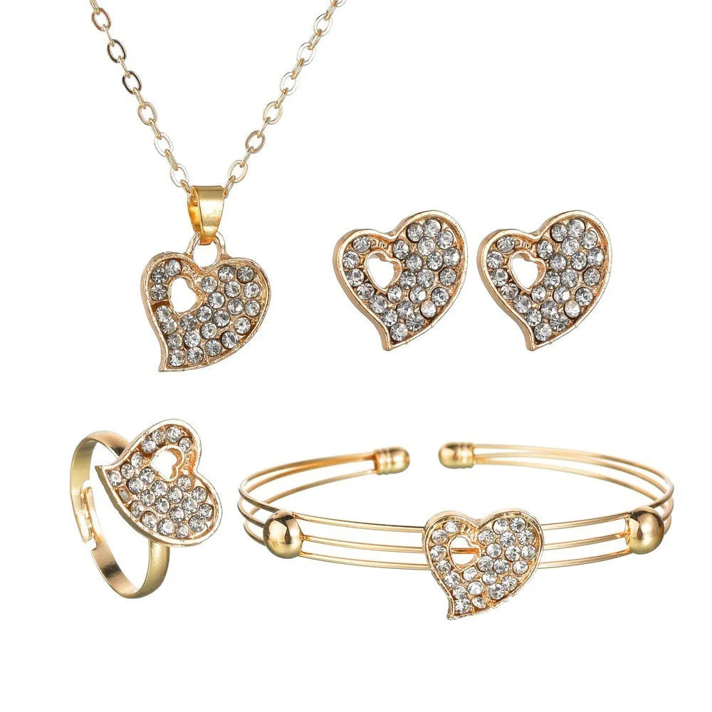 Gold electroplated women's jewellery set with love pendant necklace, earrings, and bracelet on a white background.