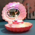 Plastic ballet girl music box in random colour, shows figure above shell, 160x130x155mm