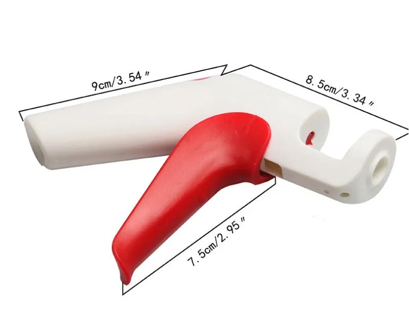 Close-up of a handheld cherry pitter with a plastic handle and stainless steel pitting mechanism