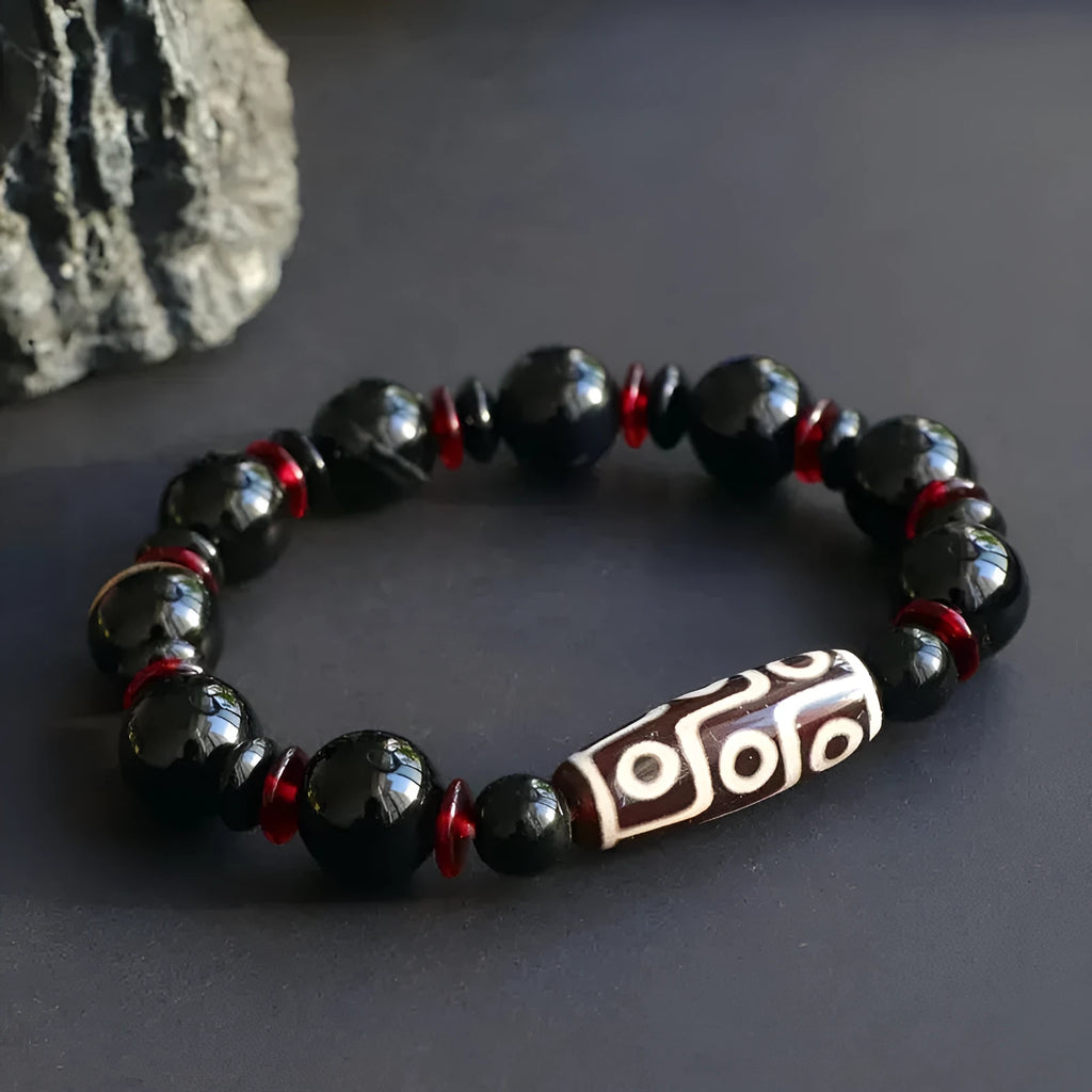 Black agate dzi bead bracelet with chalcedony stones in geometric design