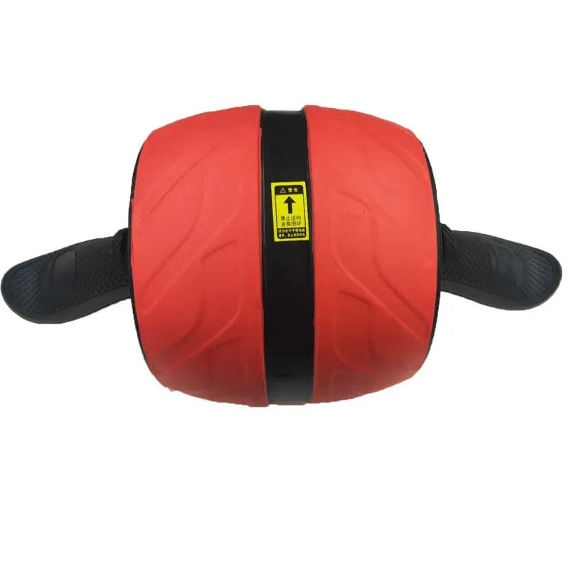 Home abdominal wheel in Black red with PP handle and spring boost mechanism on a flat surface