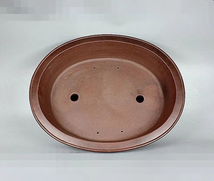 Handmade antique oval bonsai pot in Yixing purple mud, outer dimensions 66cm by 53cm, with a large planting area for pine and cypress
