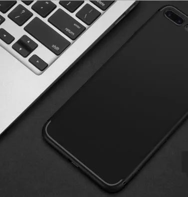 Flexible black silicone protective case for an iPhone, showing the model cutouts.