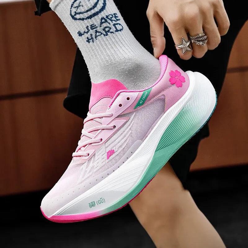Low-top racing sneaker in various colours with a carbon plate sole, PU mesh upper, and lace-up front.