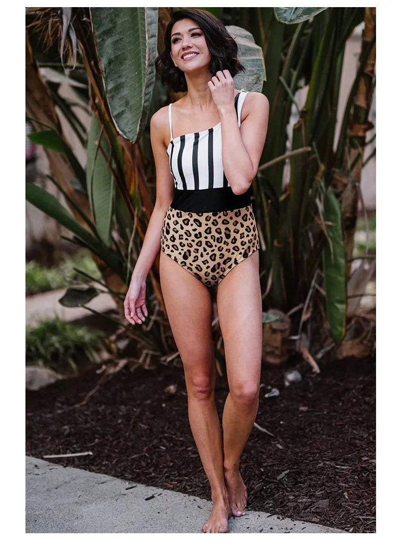 Leopard print women's one-piece swimsuit with an asymmetric collar and high waist on a mannequin