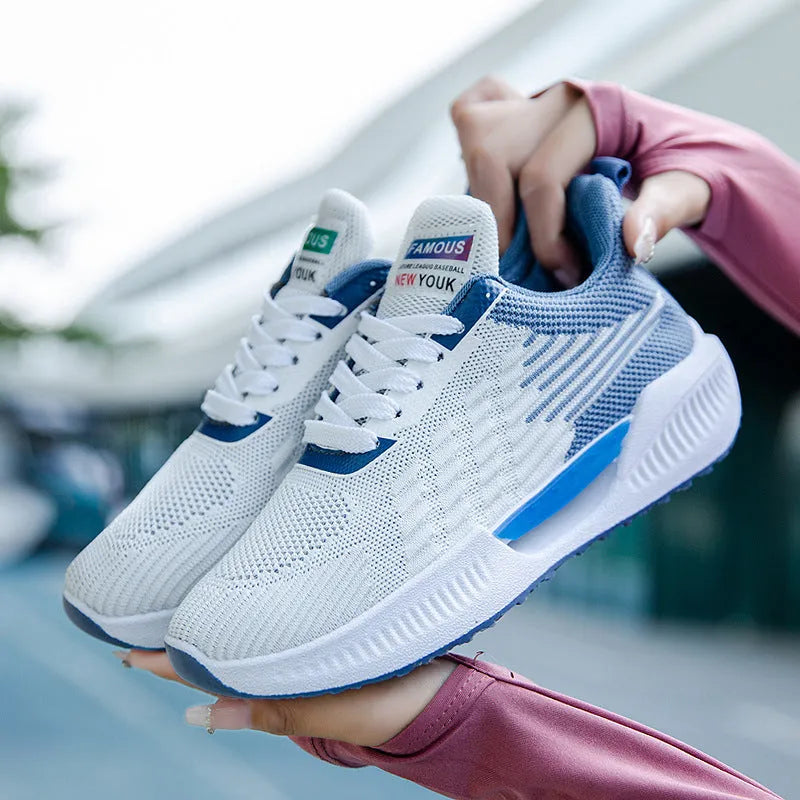Men's blue breathable casual sports shoe with cloth upper and plastic sole on a white background.