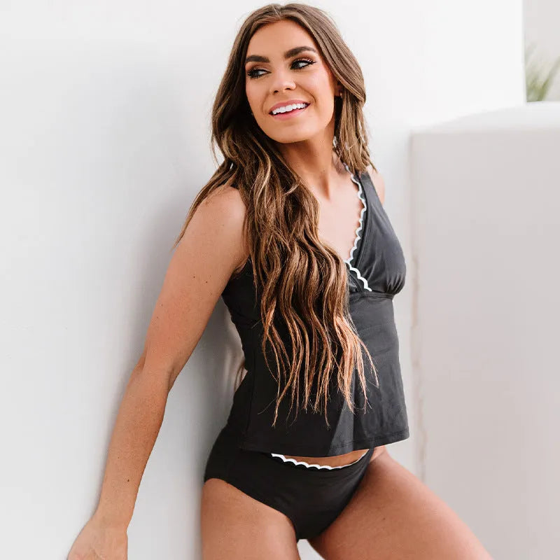 Black women's two-piece sleeveless bikini swimsuit made from nylon fabric.