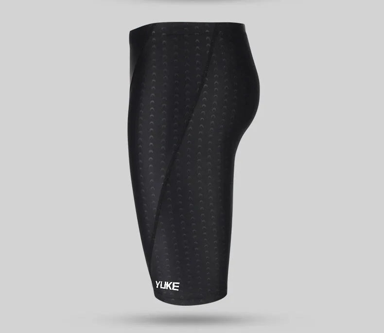 Men's black swim set with trunks, anti-fog goggles, waterproof cap, ear plugs with nose clip, and swimming bag