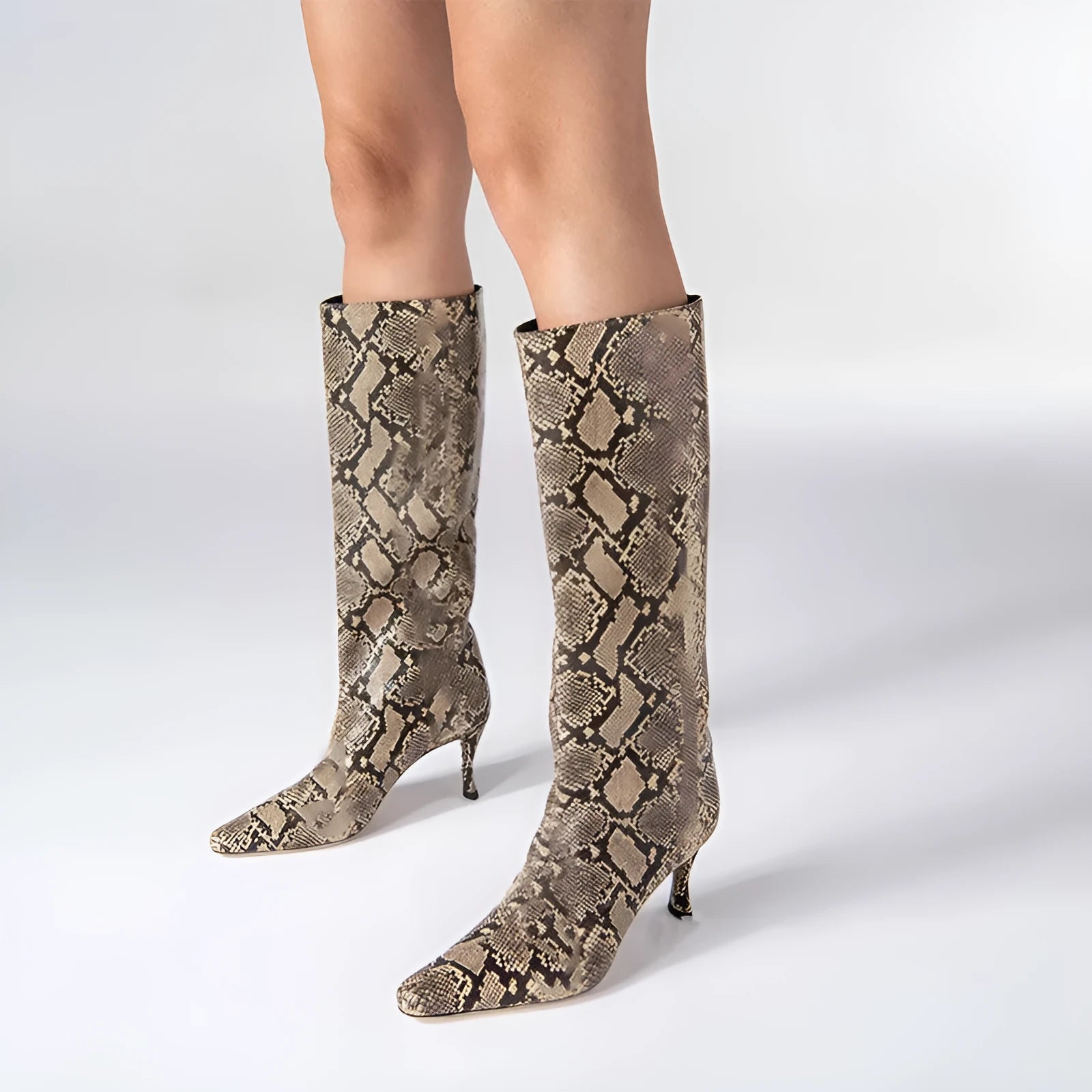 Women's square toe cowboy boots in microfibre available in multiple colours including black, snake pattern, and brown stone