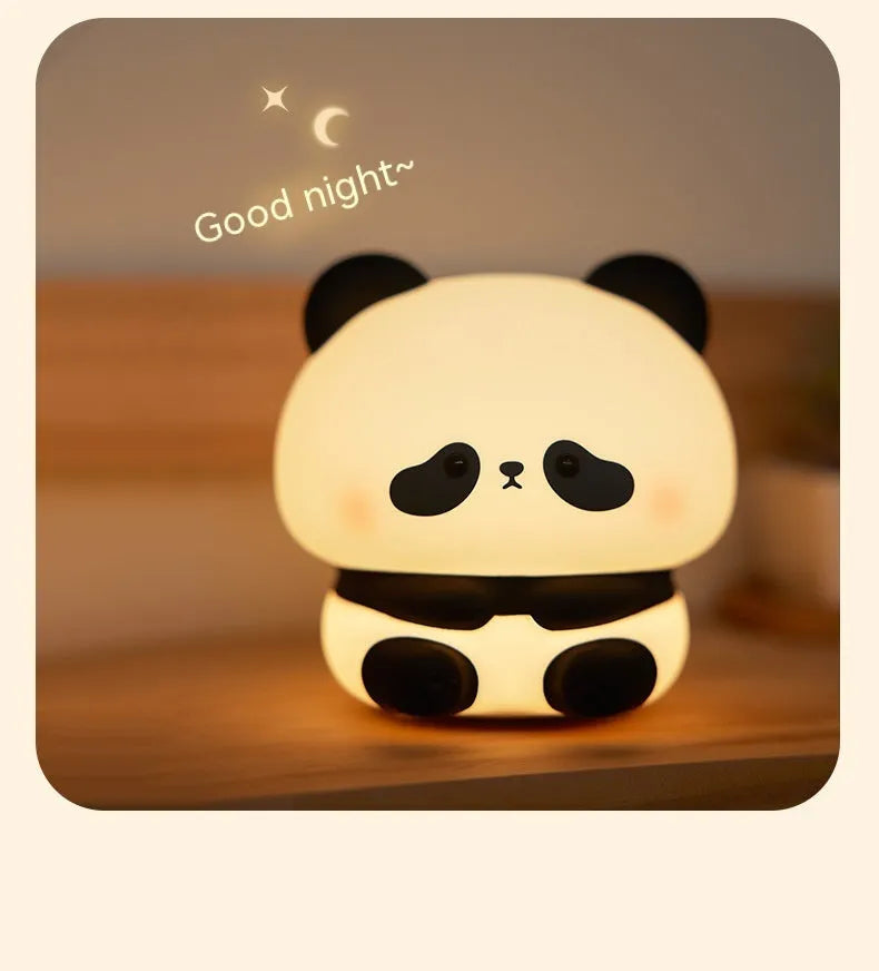 Panda LED night light with soft silicone head and colourful glow on a wooden table