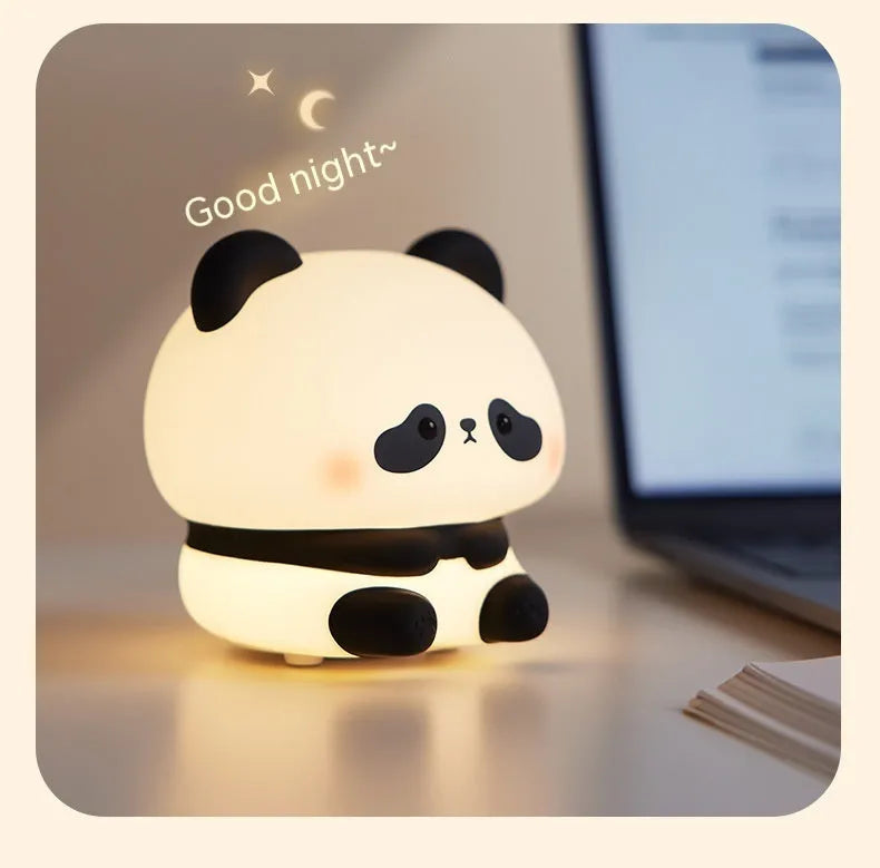 Panda LED night light with soft silicone head and colourful glow on a wooden table