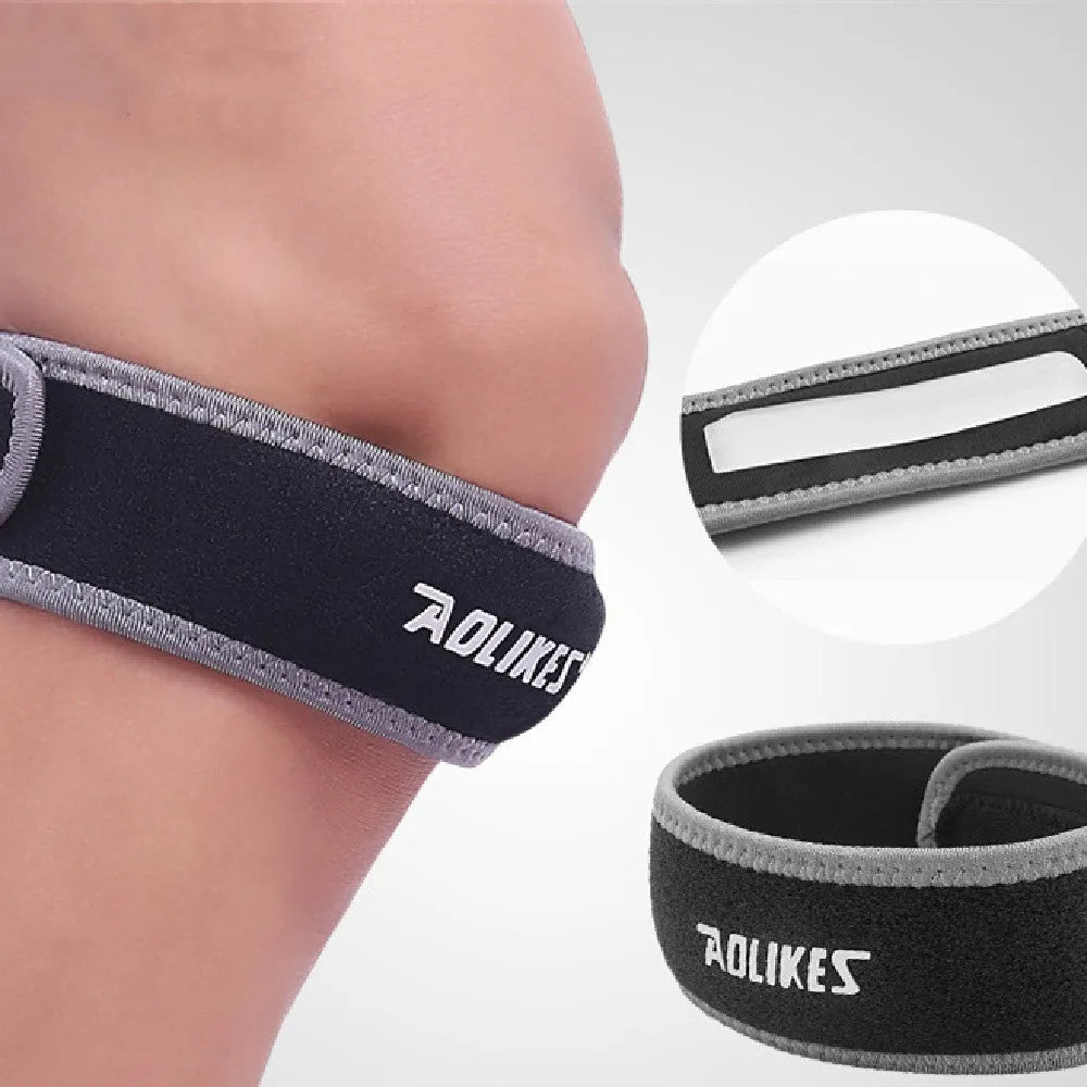 Black and grey patellar retinaculum knee support for running and sports.