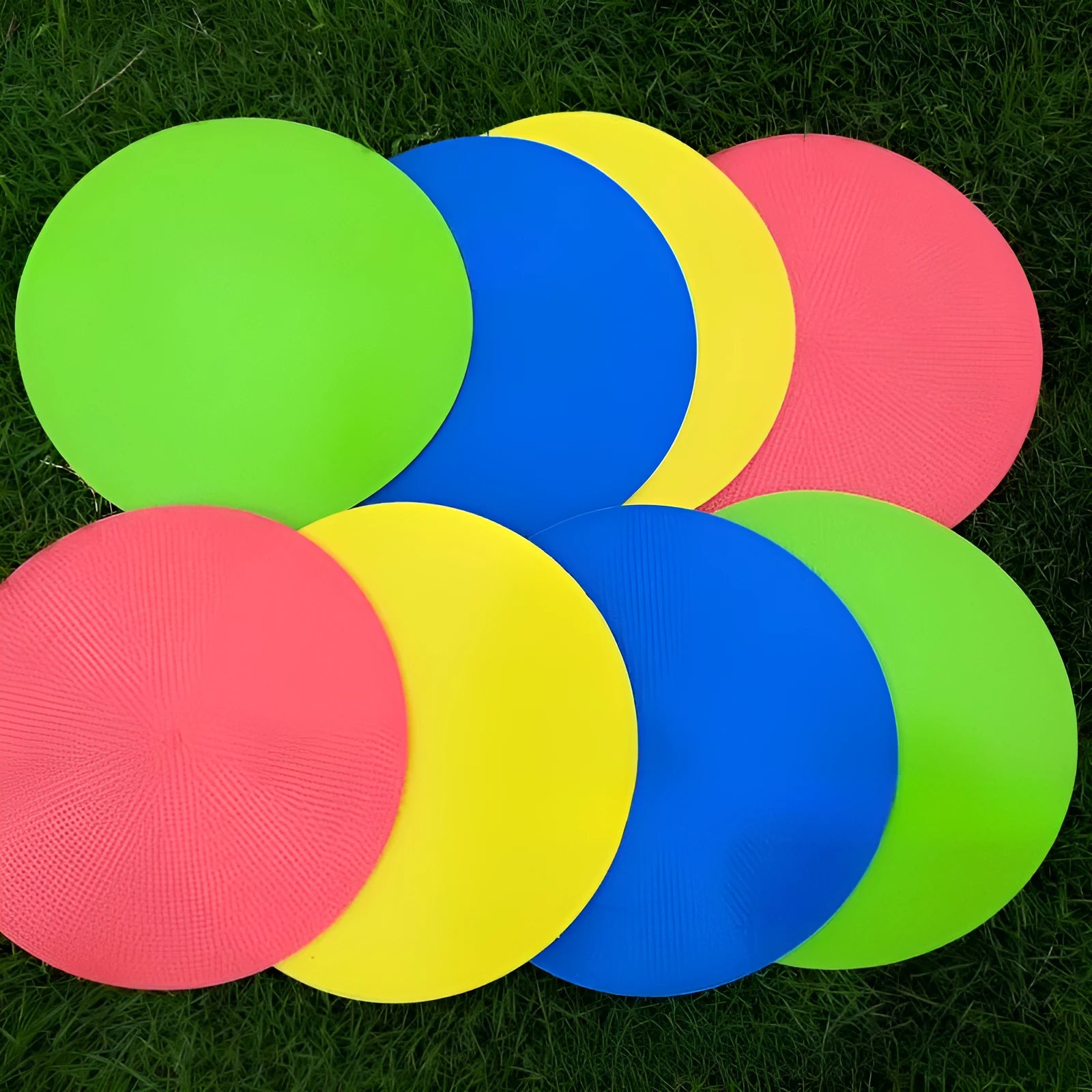 Soft yellow football landmark pad disc on grass, 23cm diameter, for training targets.