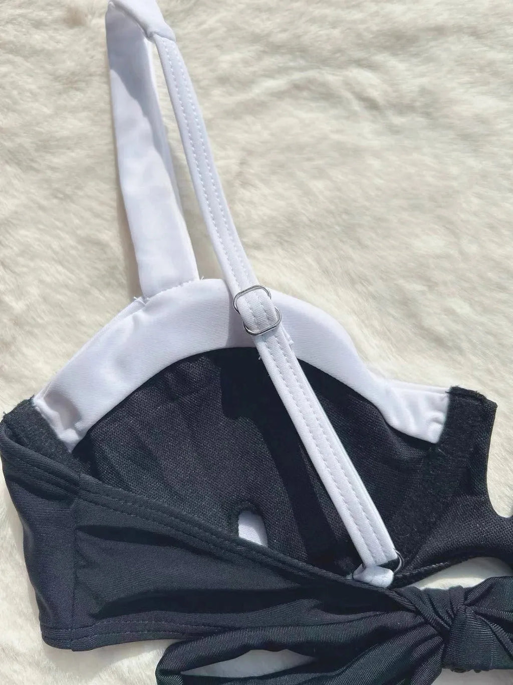 Black low waist women's bikini swimsuit with stitching split detail on briefs