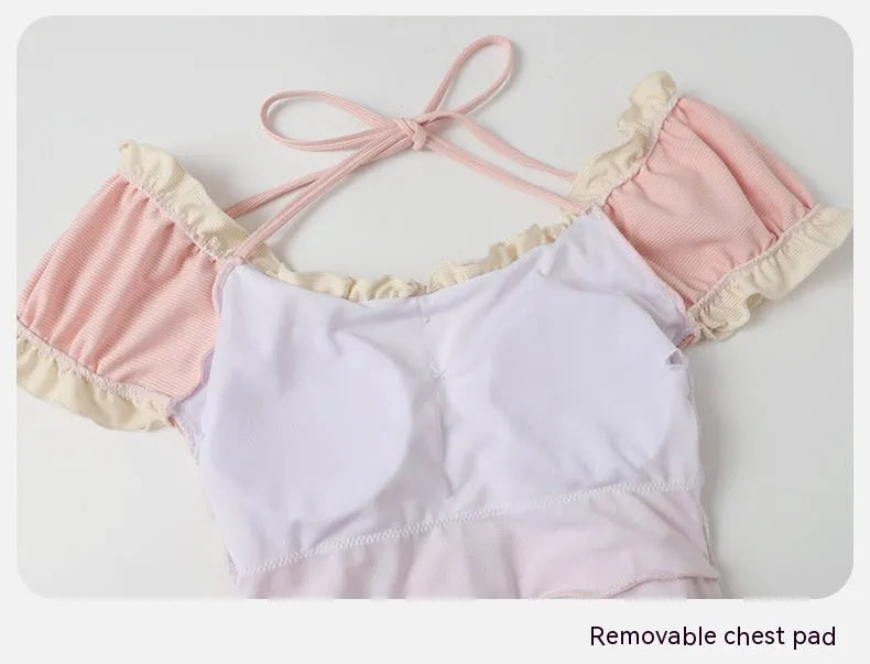 Pink women's conservative one-piece swimsuit with Siamese-inspired cute design