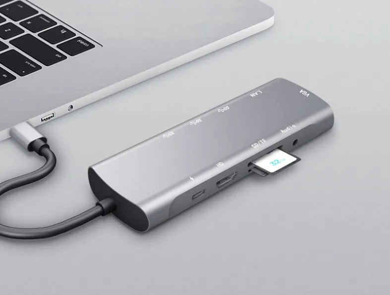Grey aluminium USB-C docking station with HDMI, VGA, and USB 3.0 ports