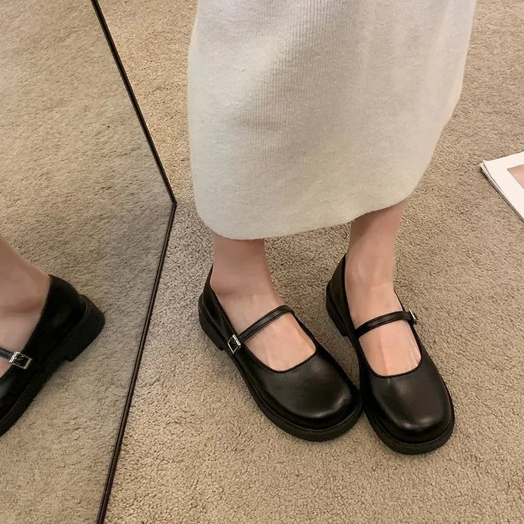 Women's flat-heeled leather shoes with round toe in red, black, and grey colour options showing vintage French styling
