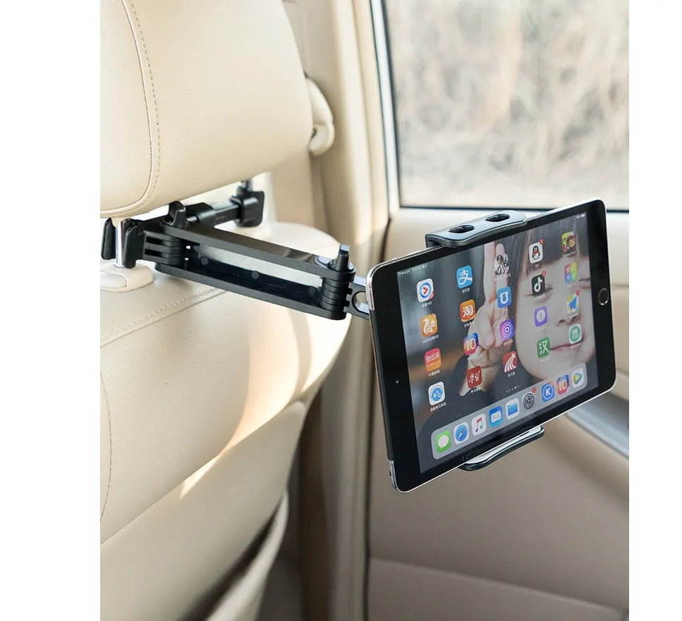 Black universal car phone and tablet holder with adjustable clamp mounted on vehicle rear seat