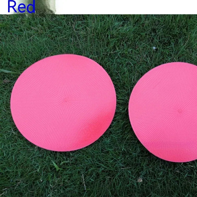 Soft yellow football landmark pad disc on grass, 23cm diameter, for training targets.