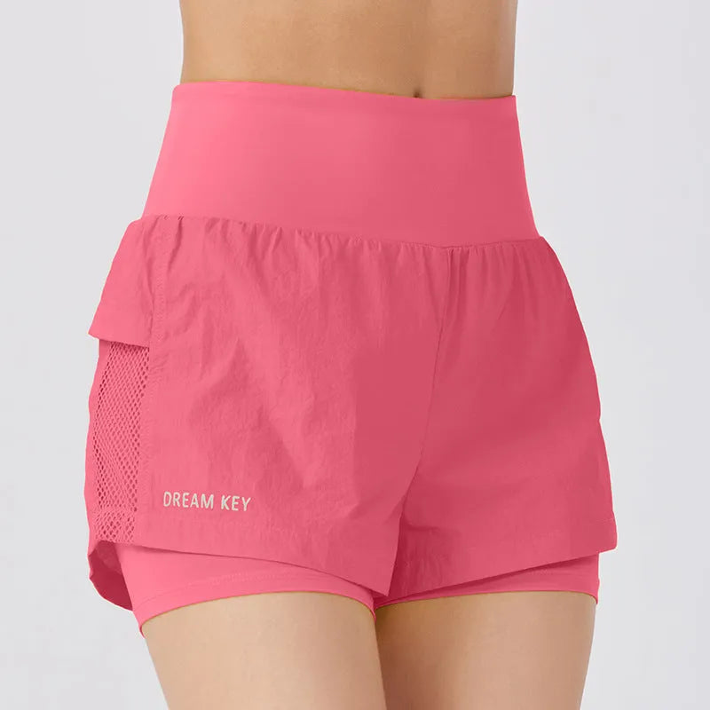 Women's loose fit cotton blend fitness shorts in lemon yellow colour on a hanger
