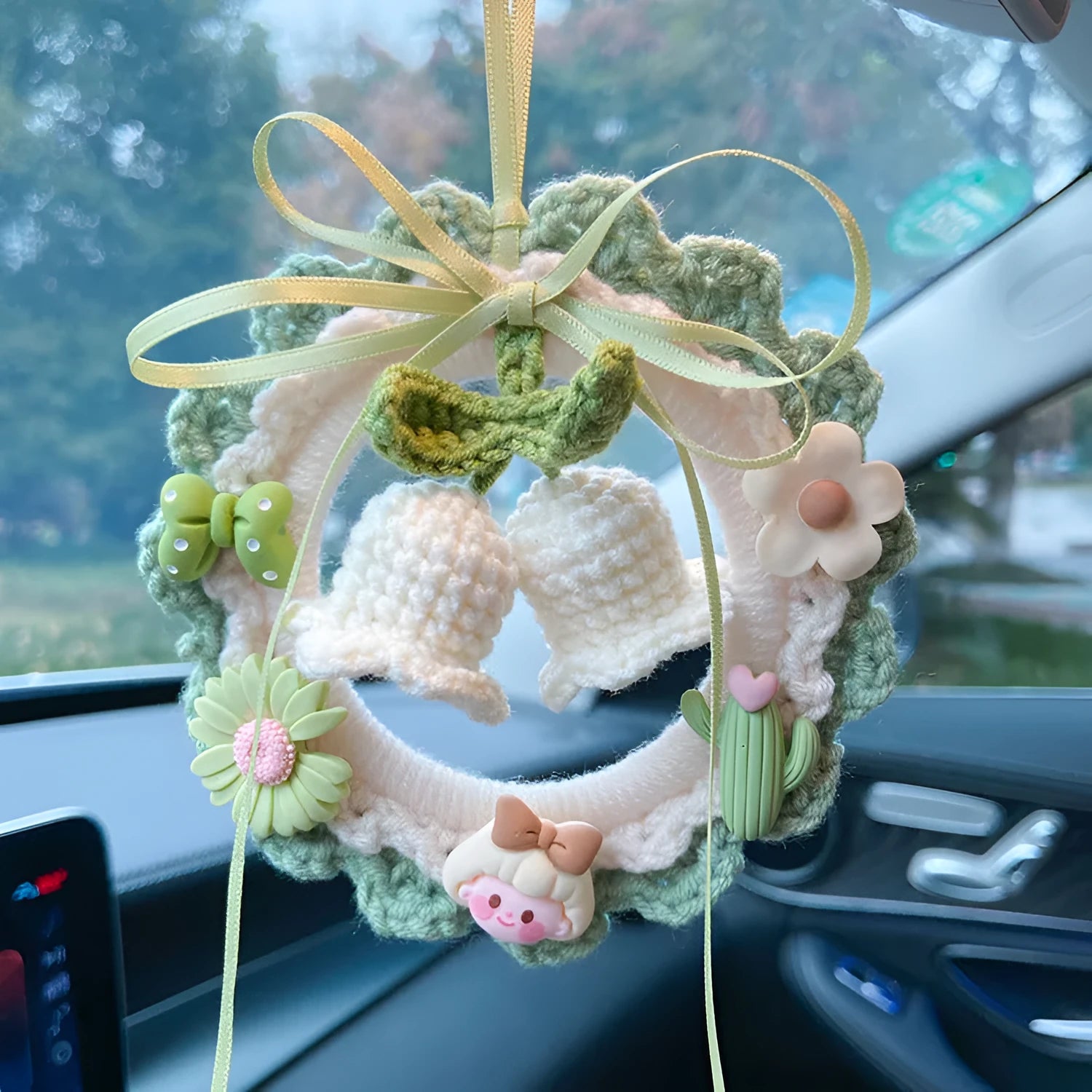 Handmade wool bell orchid car pendant hanging from rear-view mirror
