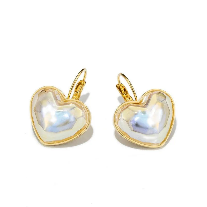 Gold coloured alloy women's ear clip with natural style and metal decorative elements.