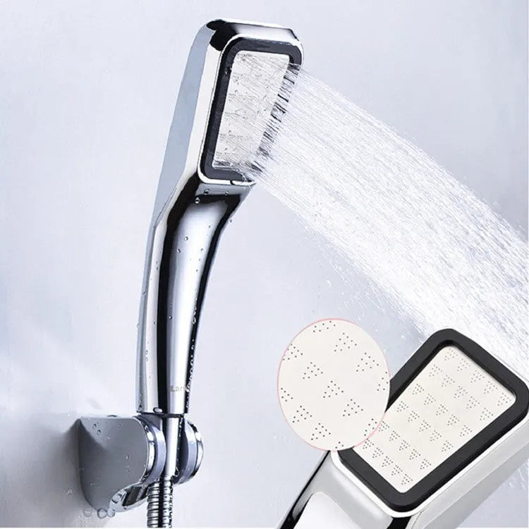 Orange hand-held pressurised shower unit with hose, showing rain shower head and control button.