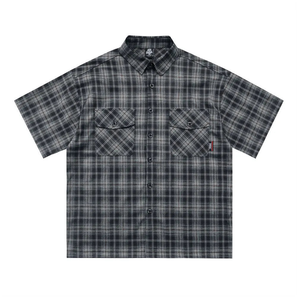 Men's black and brown plaid short sleeve shirt with embroidered letter and lapel collar.
