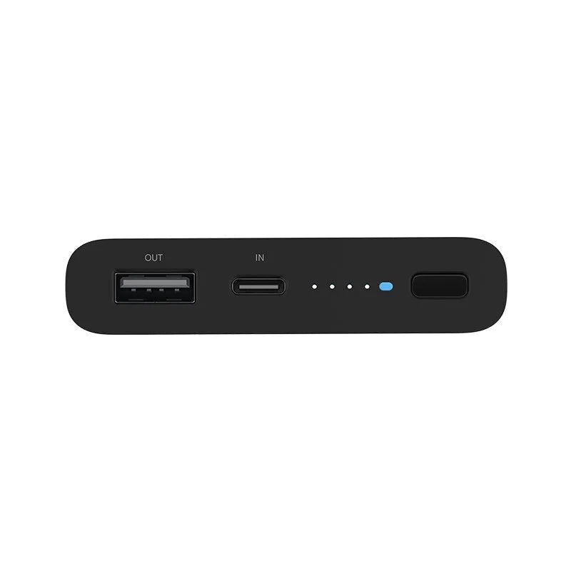 Black and white 10000mAh capacity power bank with wireless charging and fast charge support.