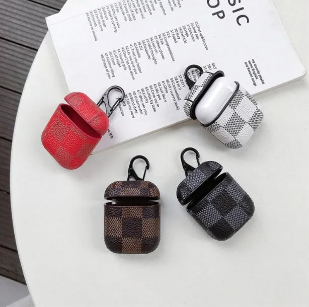 iPhone XS Max hard shell plastic case with grid pattern and integrated hook for Apple AirPods 2nd gen case.
