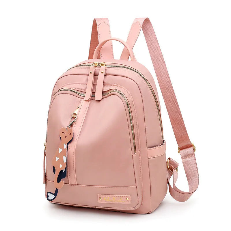 Women's casual backpack in black or pink with 20L capacity, waterproof nylon construction, and internal organiser compartments