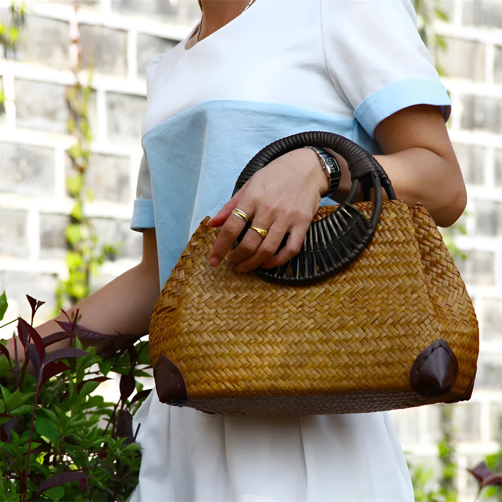 Handwoven rattan straw bag for women with wooden handle, cotton lining, and zipper closure in khaki colour