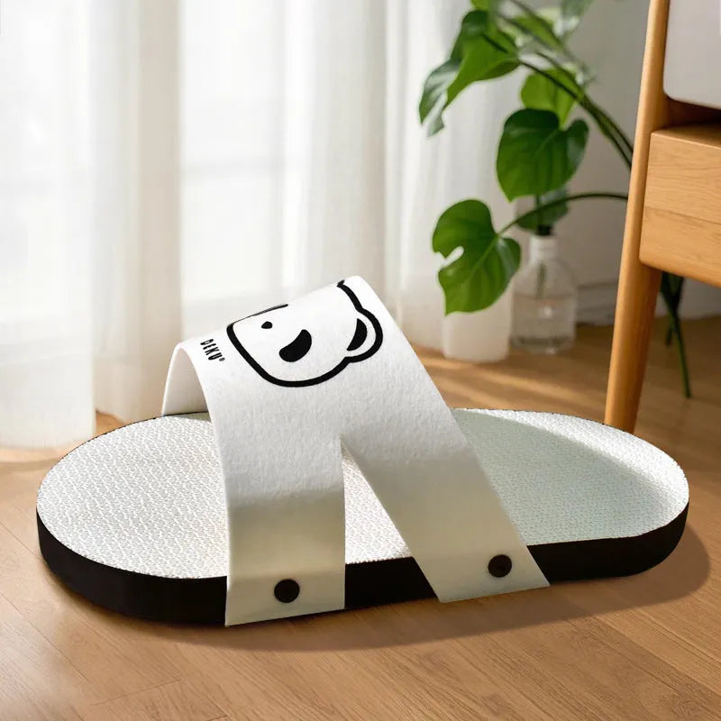 White corrugated paper cat scratch board in slipper style design on neutral background