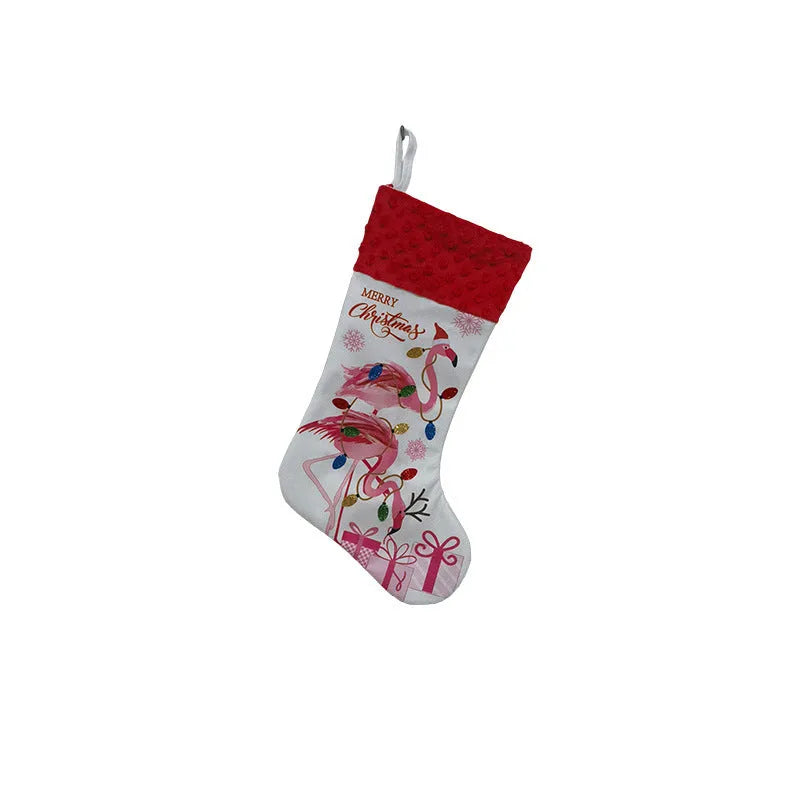 Red cloth flamingo Christmas stocking decoration with white trim, shown hanging.