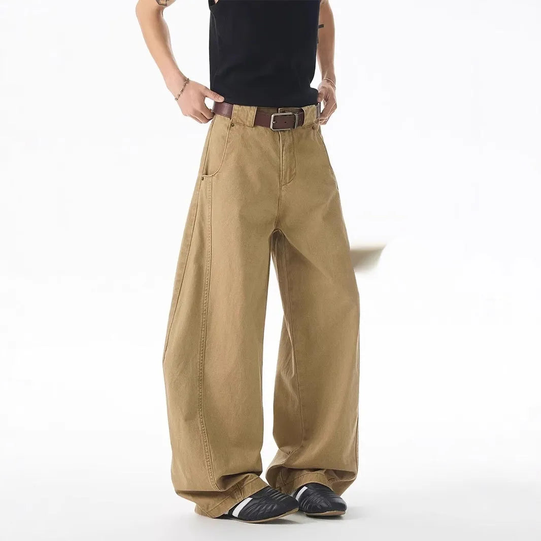 Brown men's loose fit straight leg denim jeans with a button fly, shown laid flat.