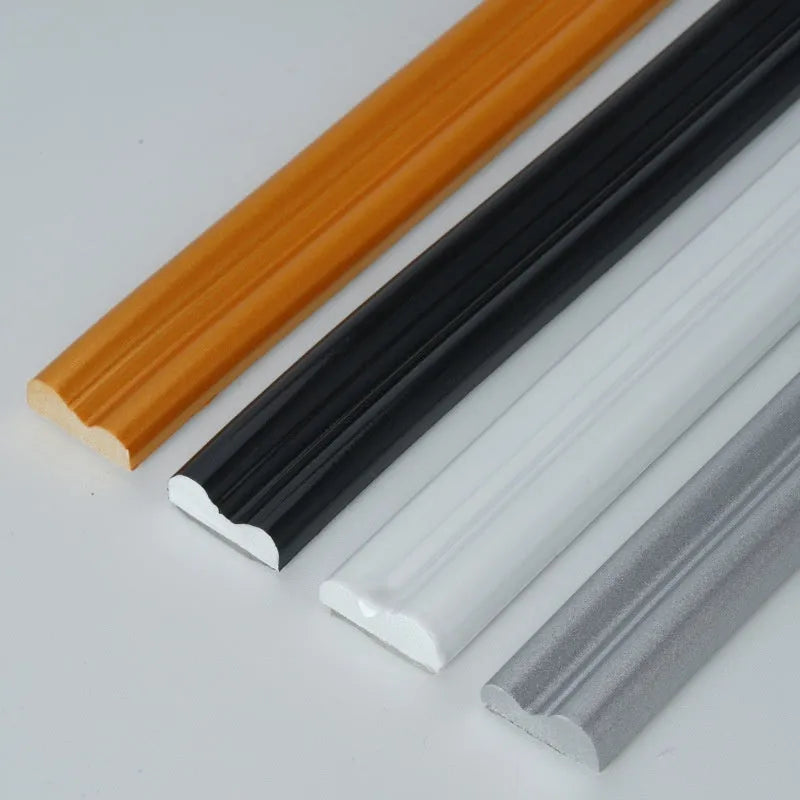 Flexible white PVC self-adhesive wall shaping frame on a blank holder.