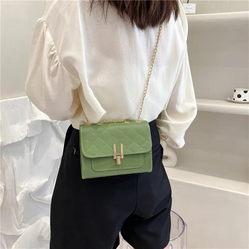 Women's crossbody bag with diamond lattice chain strap in black, white or green minimalist design